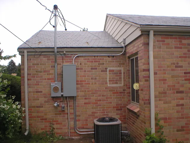 Exterior electrical panel and meter on a brick home