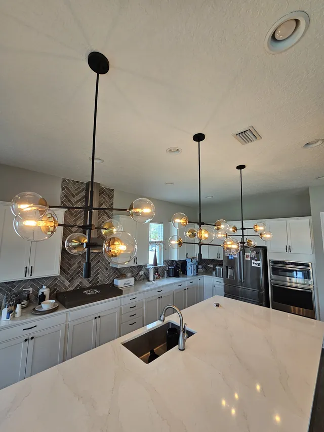 Pendant lights over a kitchen island