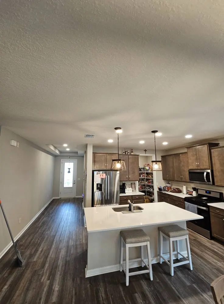 Kitchen island with pendant and recessed lights